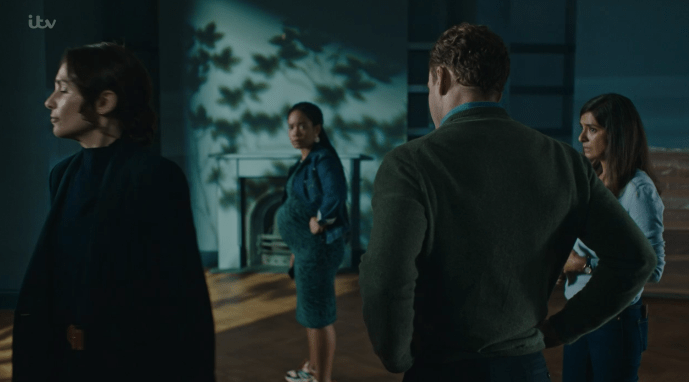 The characters were dressed in blue shades while standing in the teal-painted house