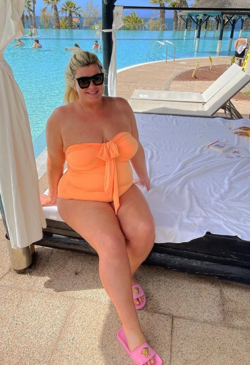 She previously flaunted her figure in an orange swimsuit