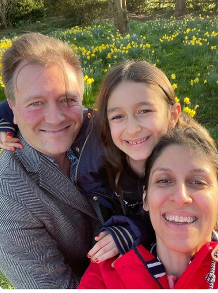 Freed Nazanin Zaghari-Ratcliffe beams in a family photo