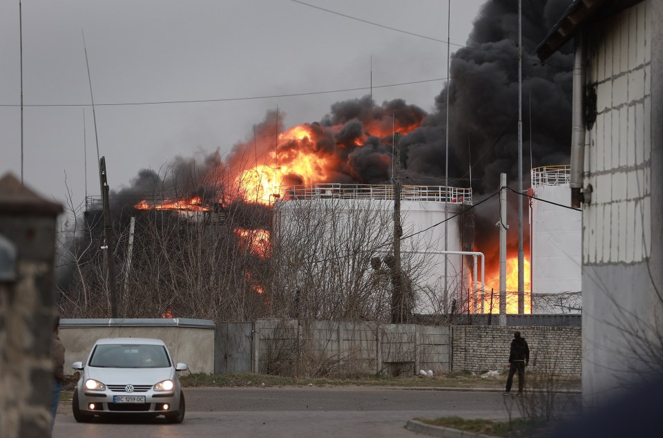 Fire billows from an industrial facility after a Russian military attack in Lviv