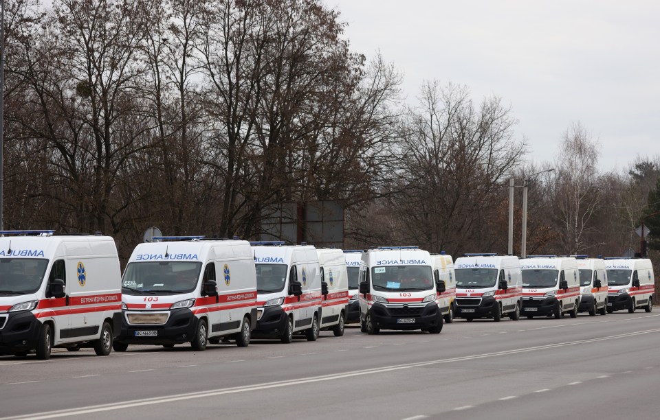 Several ambulances at the scene following the airstrike just 12 miles from the Polish border