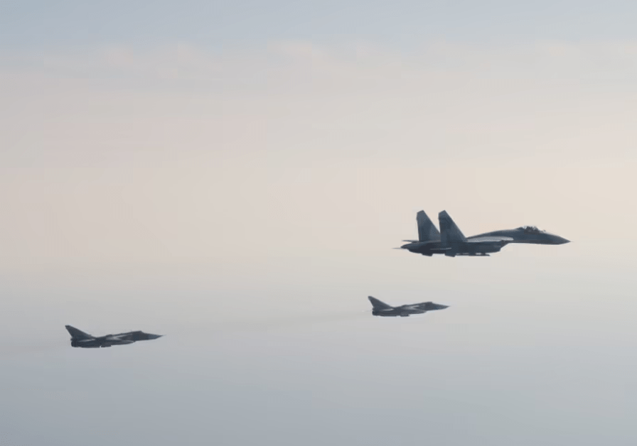 Russia's two Sukhoi Su-24s - in the background of this picture - were reportedly armed with nuclear weapons