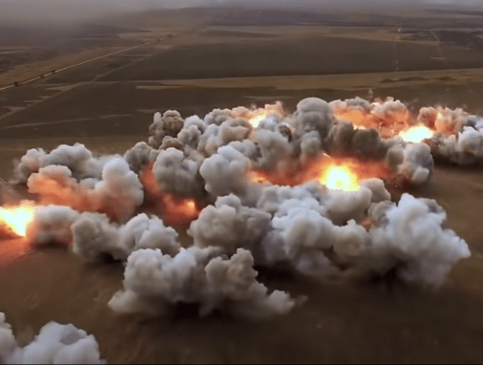 Explosions in the aftermath of a rocket barrage