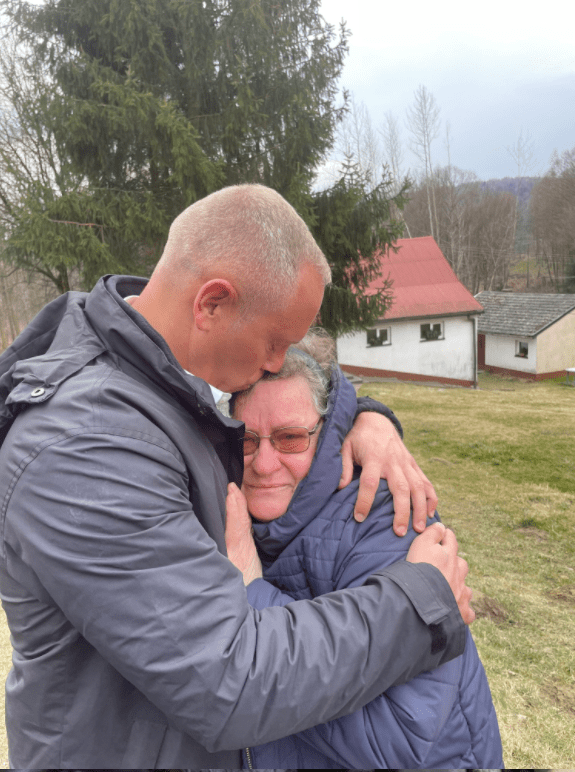 The TV star with Oksana's aunt Lidya in an emotional embrace