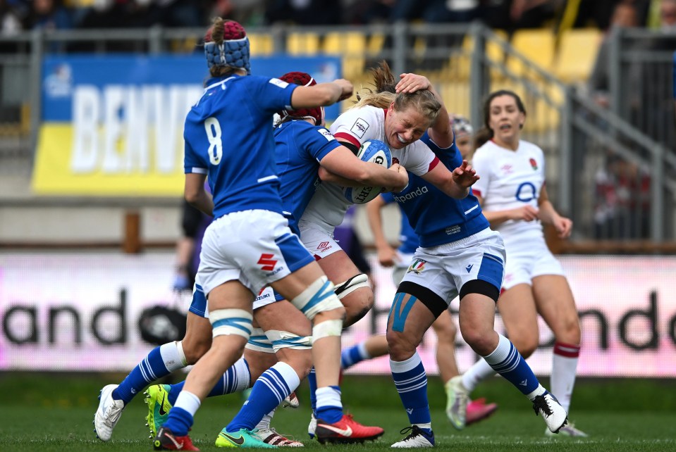 England's Alex Matthews rides the tackle of two Azzurri during their impressive 74 - 0 win over Italy last week