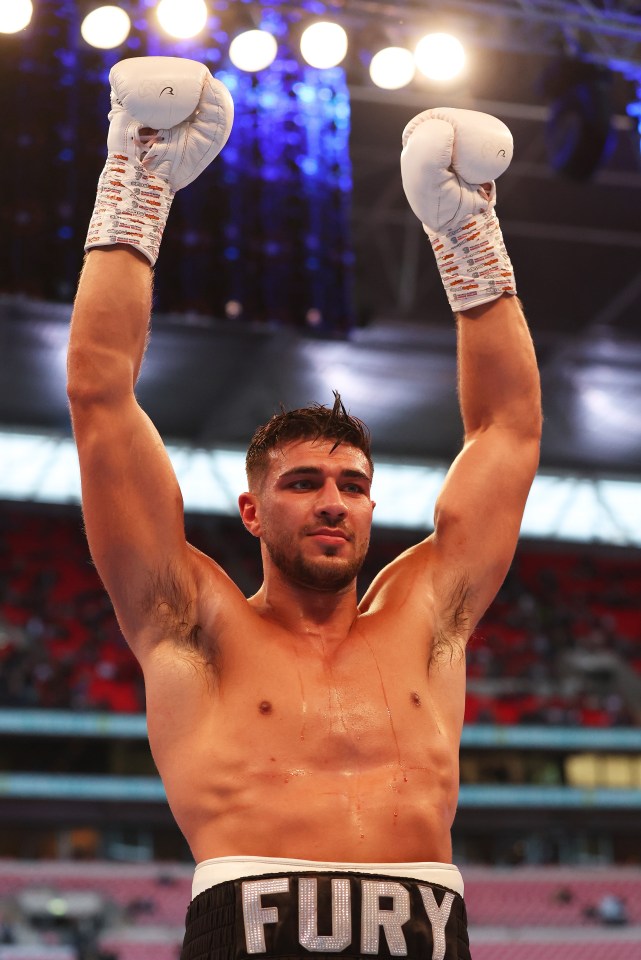 A jubilant Tommy Fury celebrates beating Daniel Bocianski