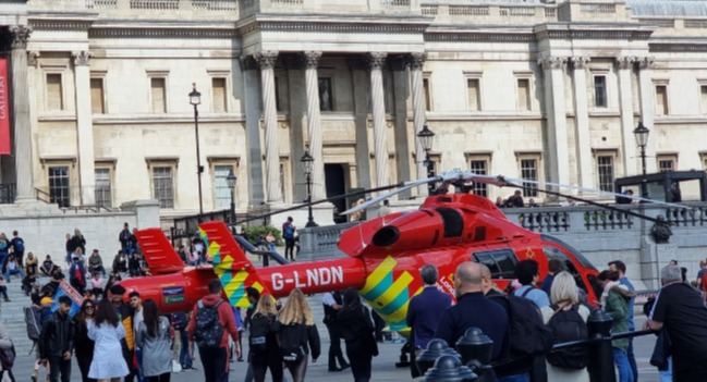 Onlookers gathered as paramedics rushed to save the pedestrian