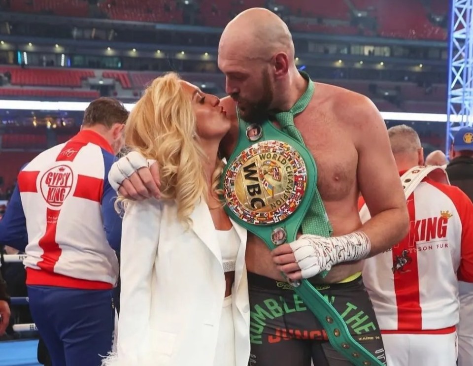 Tyson and Paris celebrate together in the ring