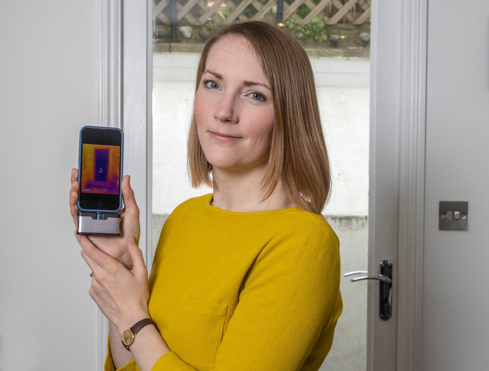 Rosie Taylor with the thermal imaging camera that she used to pinpoint heat loss areas in her home