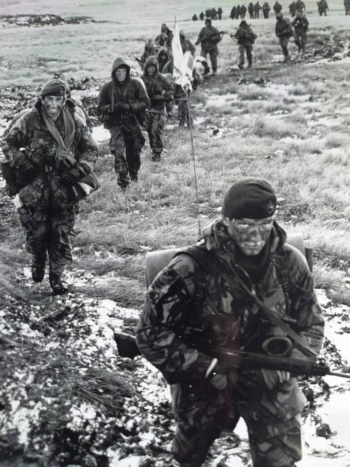 Another view of the llne of marines making the treacherous trek