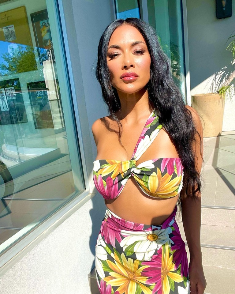 Nicole Scherzinger posed for this snap, describing the look as 'Channelling Polynesian warrior goddess vibes'