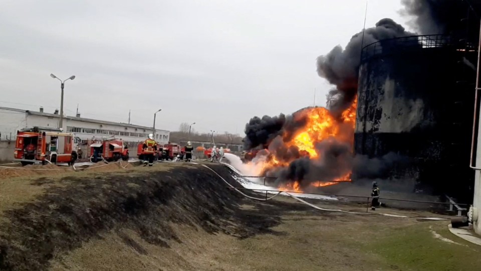 Firefighters attempting to extinguish the inferno