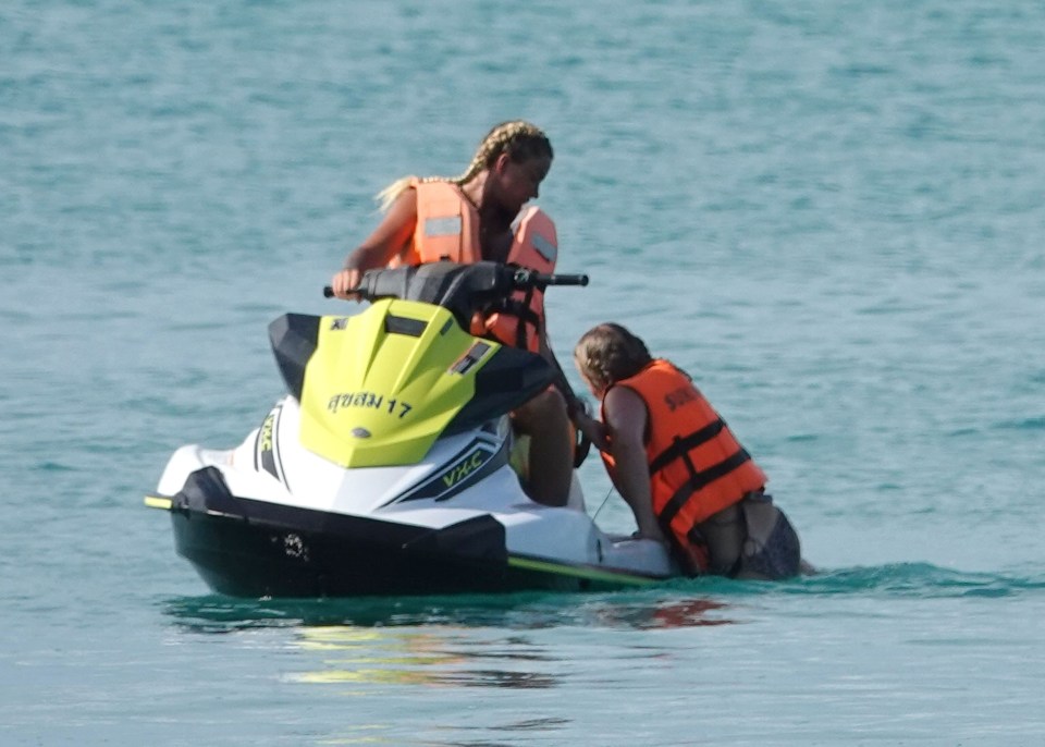 Katie wore her hair in box braids and a life jacket for safety