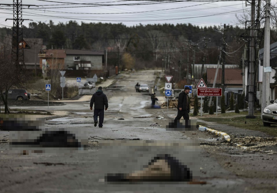 Bodies lie on a street in Bucha, northwest of Kyiv, as the UK investigates war crimes