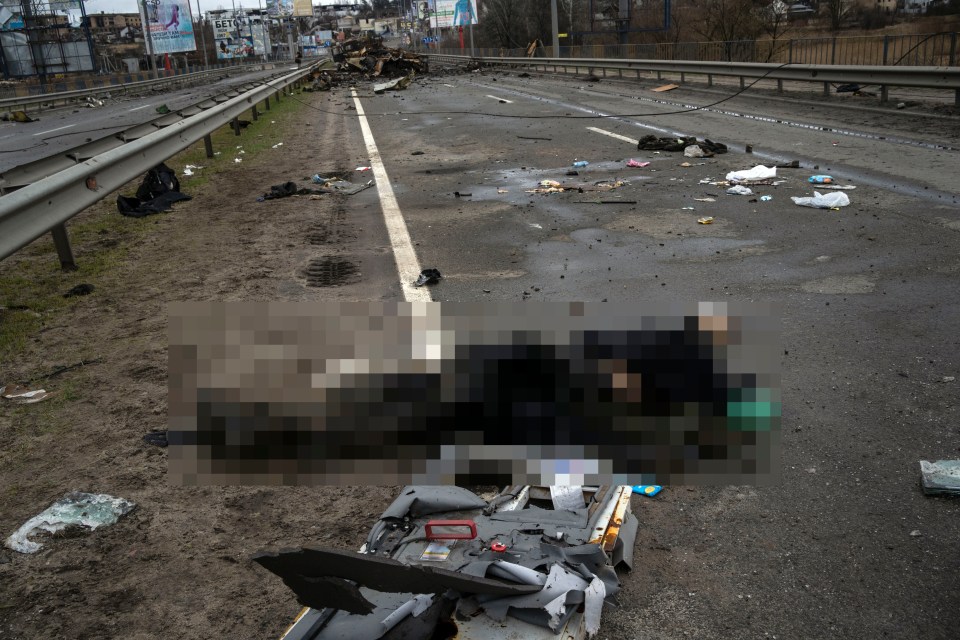 The lifeless body of a Russian soldier lies on the ground in Bucha, on the outskirts of Kyiv, Ukraine, Saturday