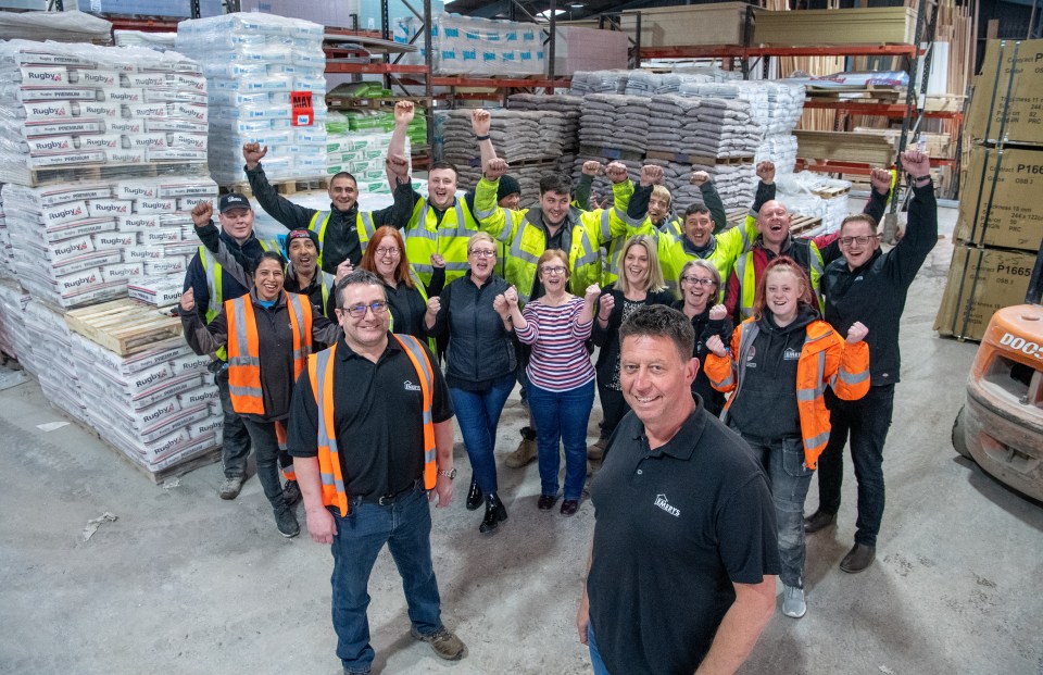 Manager Jonathon Goodwin (left, foreground) and managing director James Hipkins (right, foreground), pictured with staff at Emerys Timber and Builders