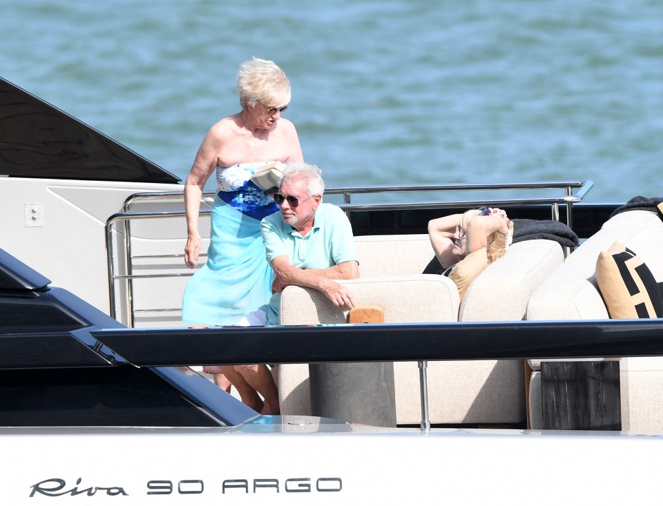 The couple's parents took over a suite of huge comfy sofas in the sunshine