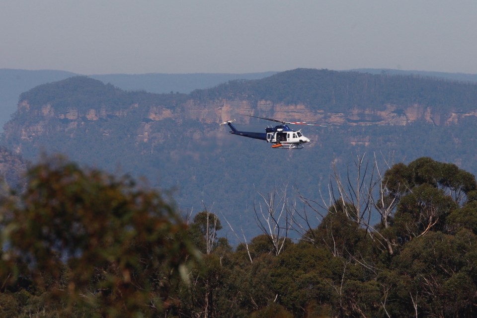 A police helicopter retrieved the two bodies from the scene