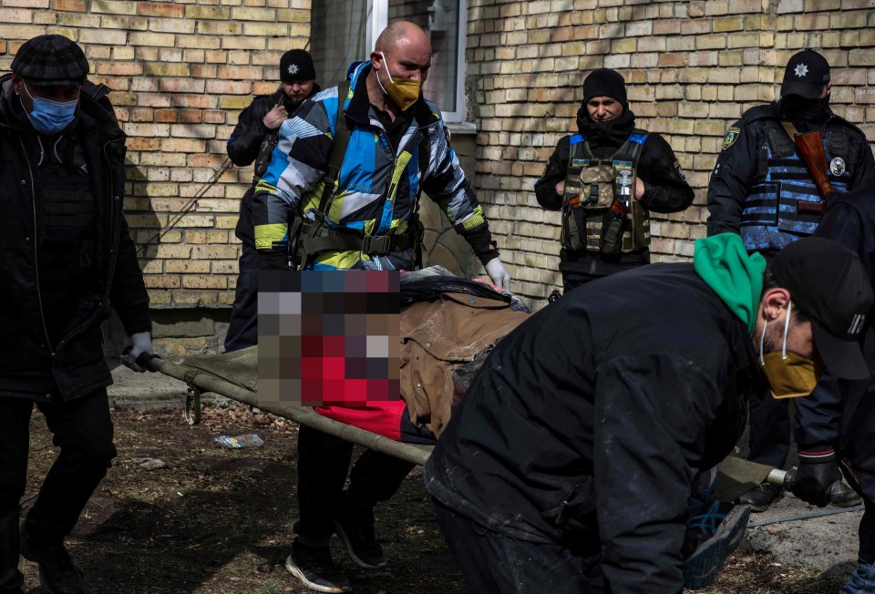 Rescue workers carried the bodies out in body bags