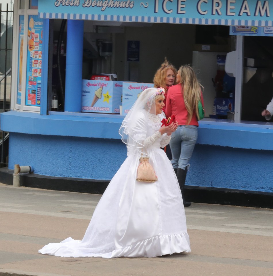 Julia can be seen in a scene with bride Jean Slater