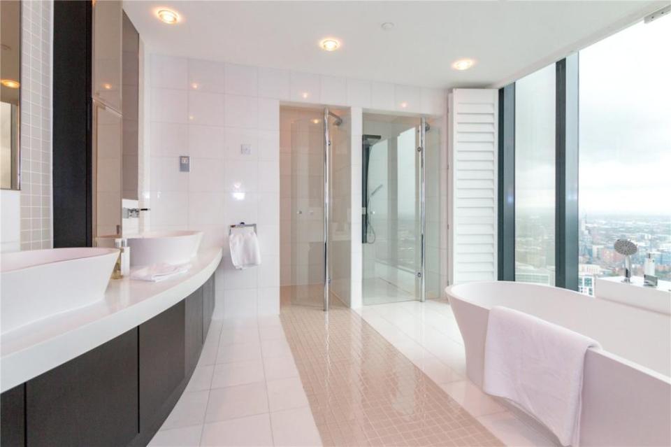 Even the bathroom boasts unparalleled views of the skyline