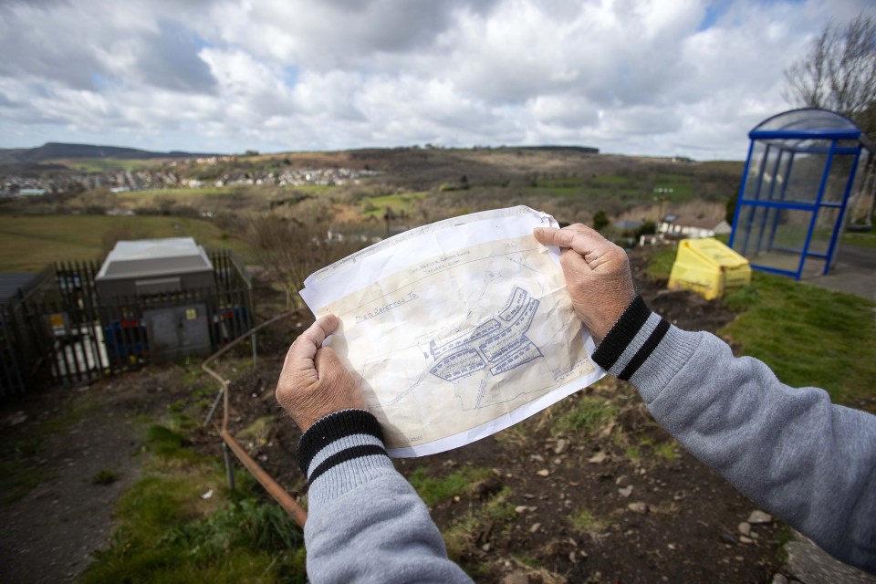 A resident holding a map from 1926 showing the footpath