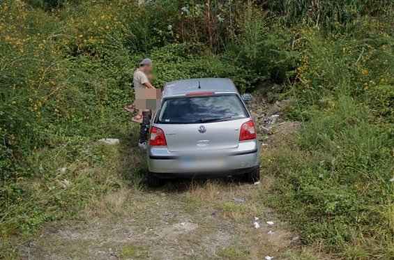 The couple were caught romping on the front of a parked car