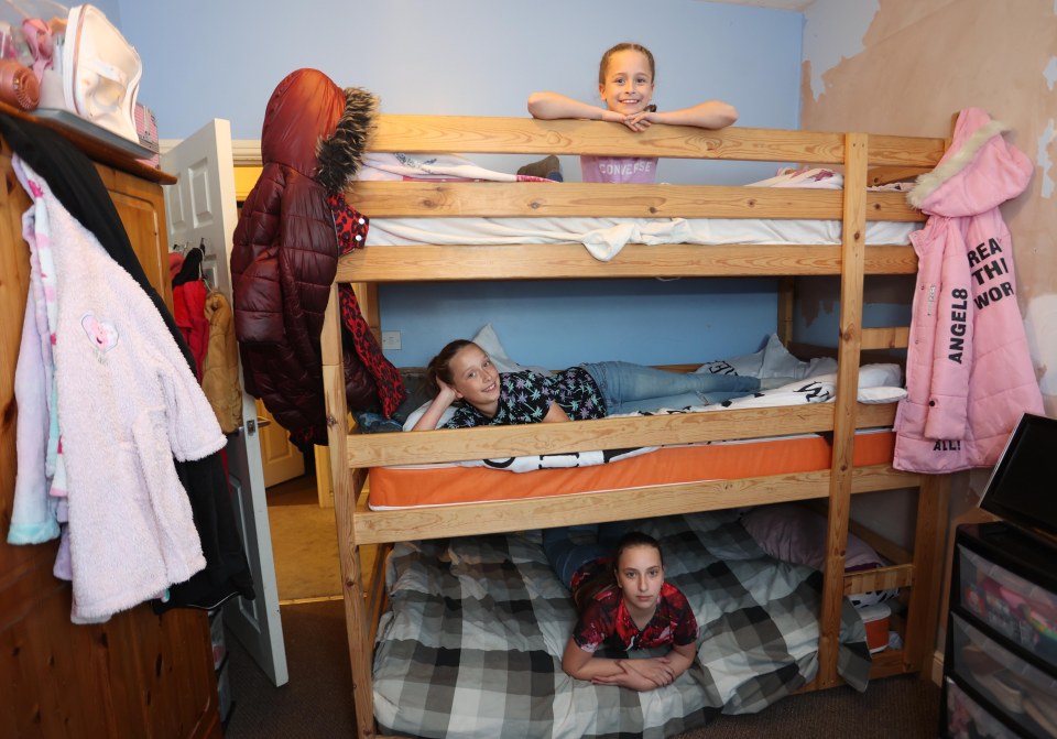 Maja, 12, Lena, 10, and Olga, 9, share bunk beds