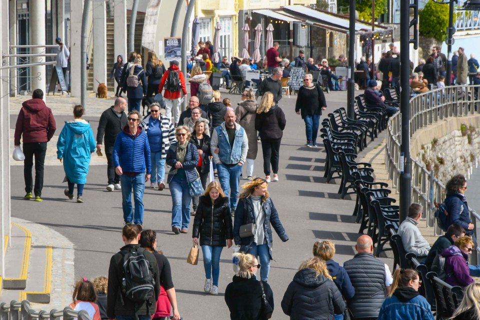 Countless sunseekers flocked to Lyme Regis in Dorset to enjoy the warm spring sunshine