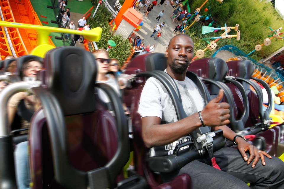 French actor Omar Sy riding the RC Racer during the opening event of Toy Story Playland