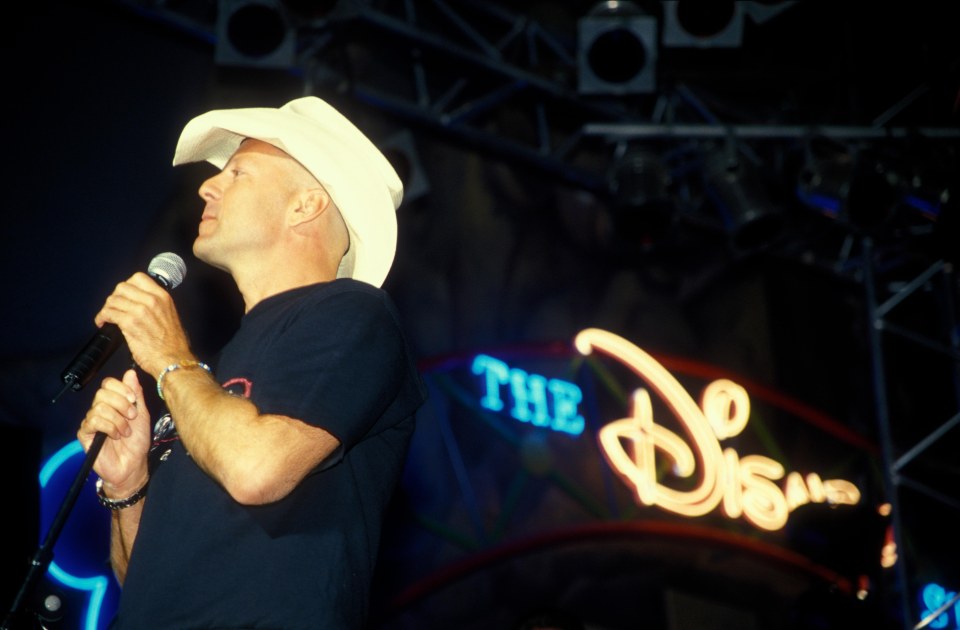 Bruce Willis performing a special showcase at Disney Village back in 2000