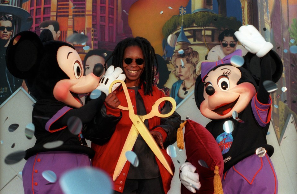 Whoopi Goldberg visiting in 1996, posing with Mickey and Minnie