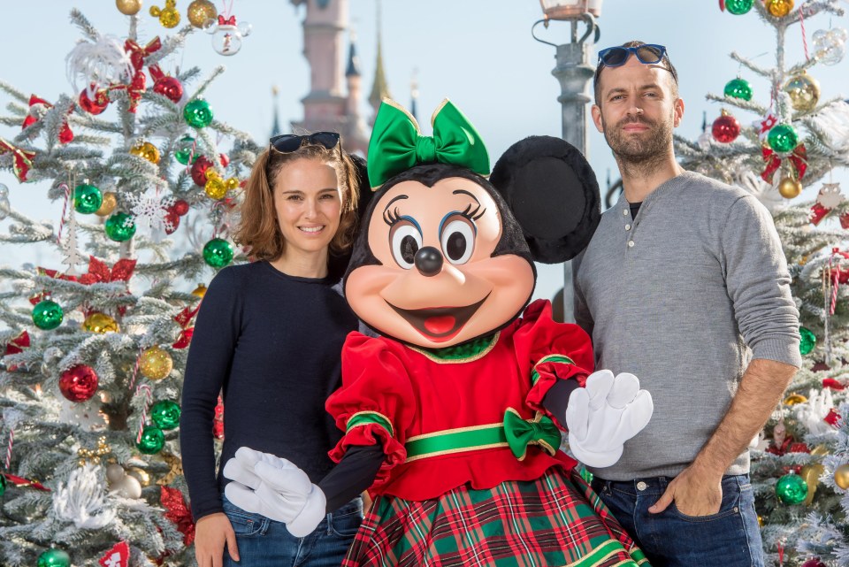 Nathalie Portman and her husband Benjamin Millepied visiting during Christmas, posing with Minnie