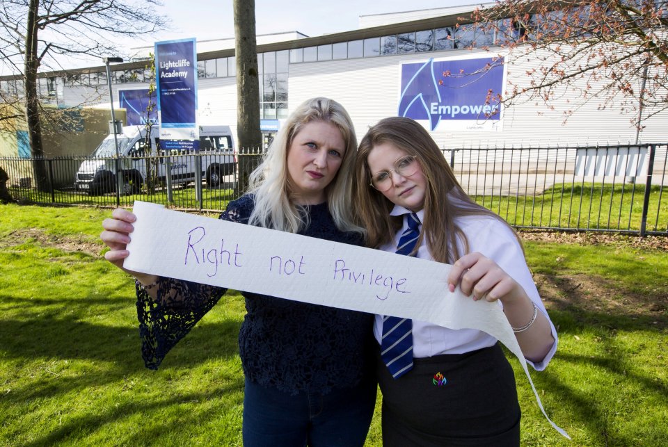 Nicola Hanson with her daughter Izzy outside Lightcliffe Academy, which has banned toilet trips during the day