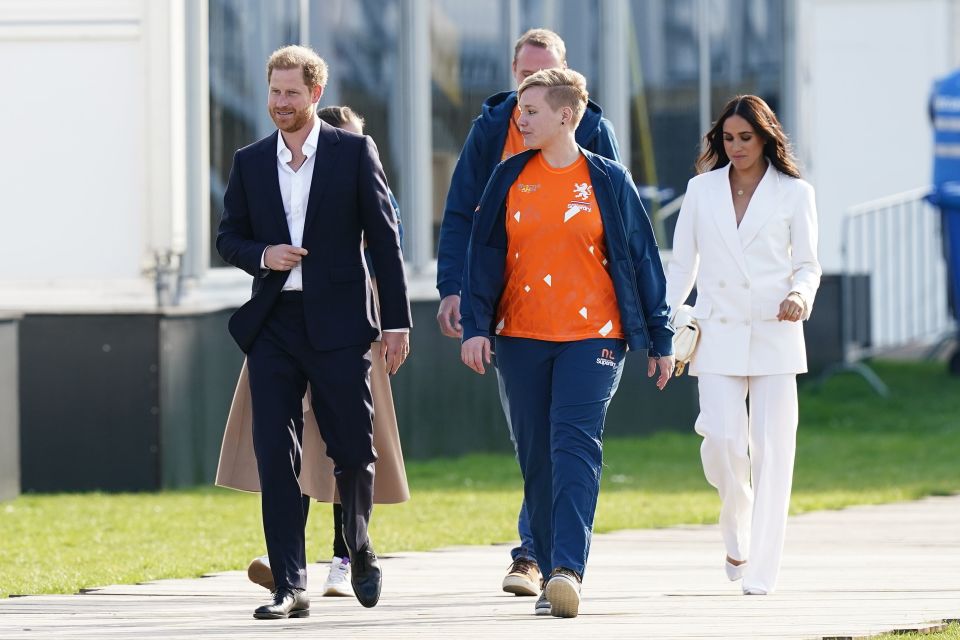 A smartly dressed Meghan and Harry arriving at the reception