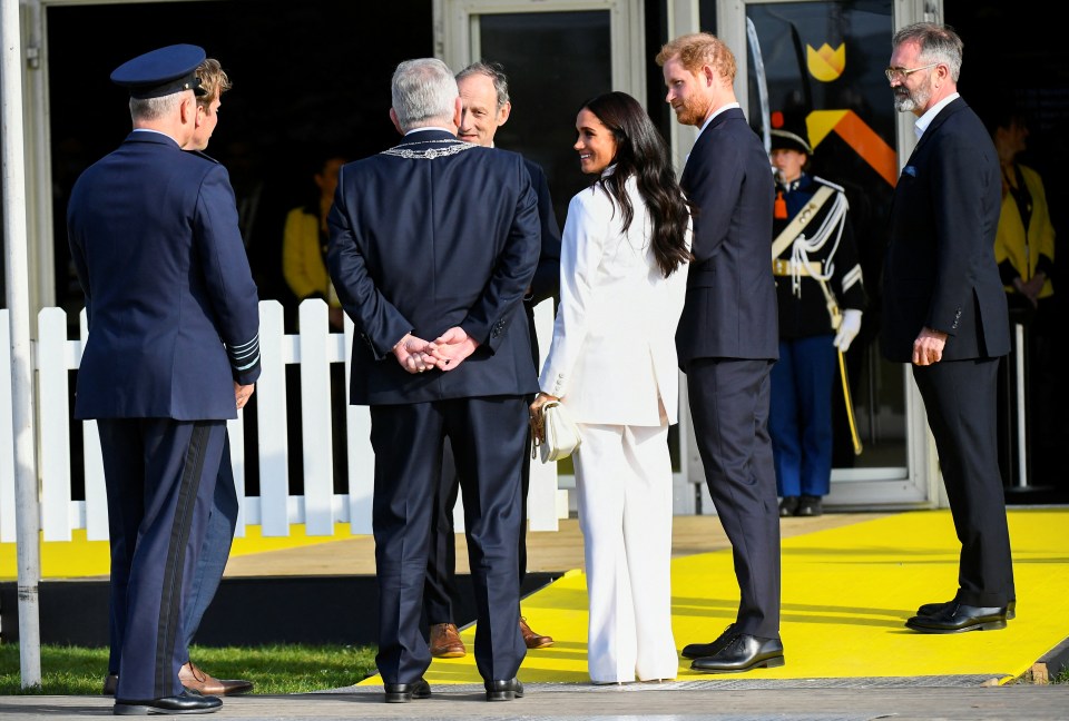 Meghan and Harry arrive at the yellow carpet of the Invictus Games to attend the friends and family reception in The Hague