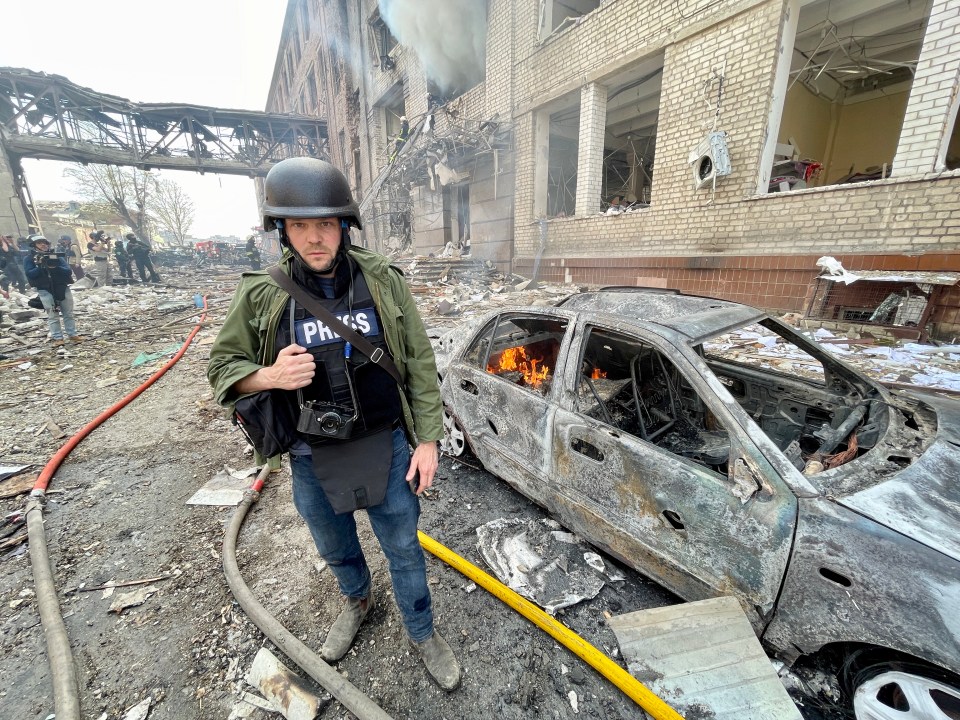 The Sun’s Jerome Starkey stands among the wreckage of a Russian missile attack in Kharkiv