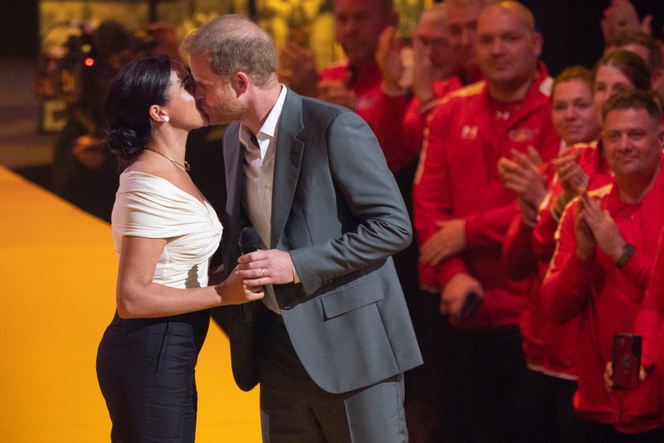 She made the barbed comment as she took to the stage and kissed Prince Harry at the Invictus Games opening.