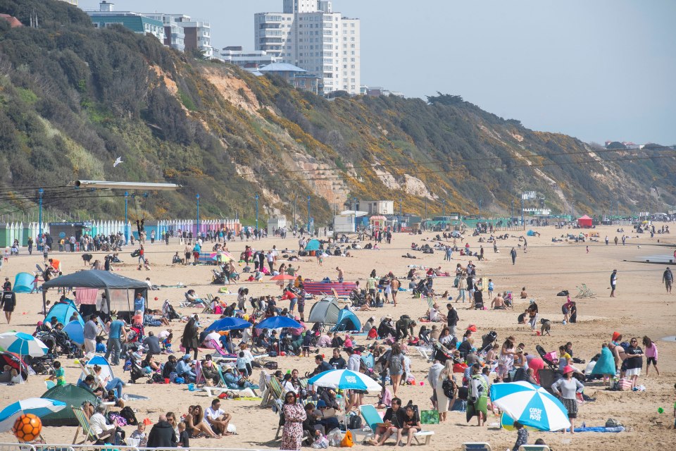 Families enjoy the sunshine on the beach in Bournemouth, Dorset, on Easter Sunday