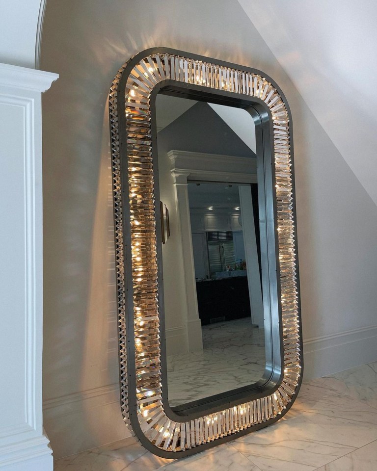 The Timothy Oulton mirror is 2.4metres tall and weighs 165kgs