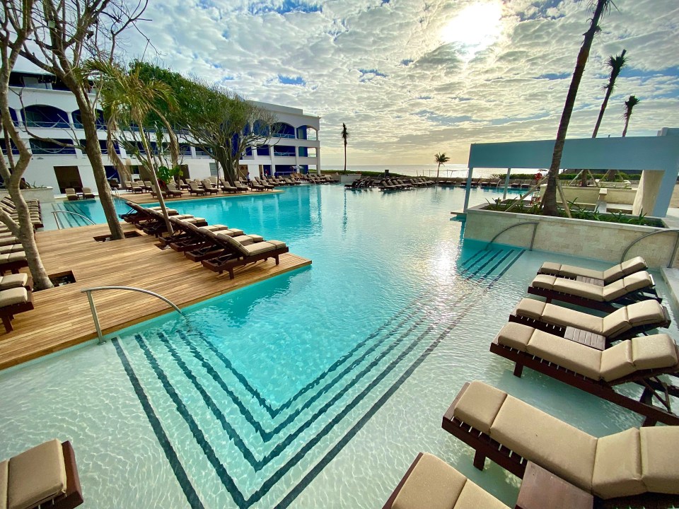 The Hard Rock Hotel Riviera Maya has a snorkelling sea cove and five pools, six bubbling Jacuzzis and a huge spa