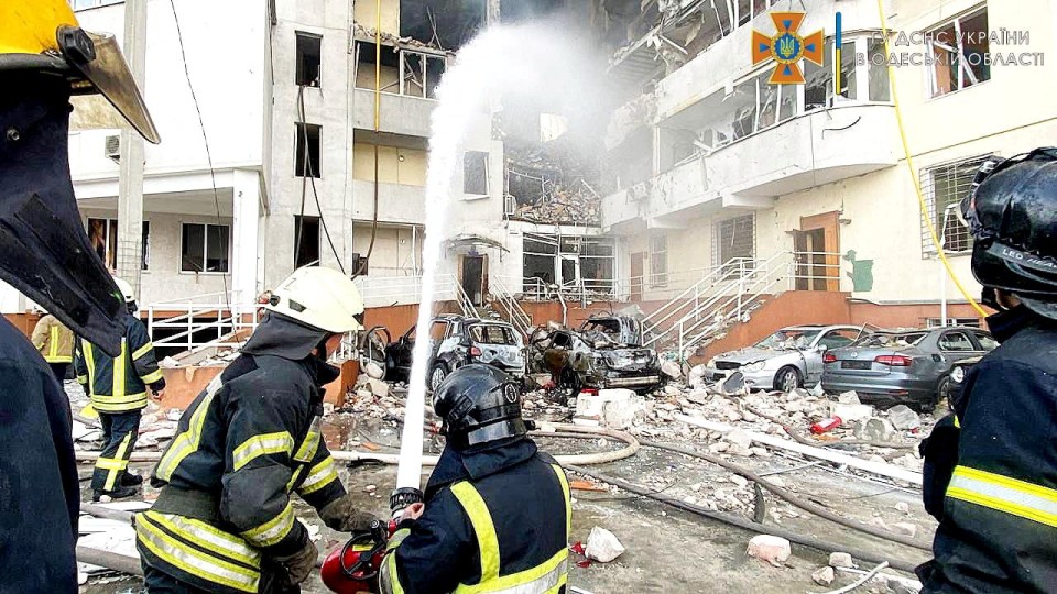 Emergency service workers extinguish fire at one of the residential towers