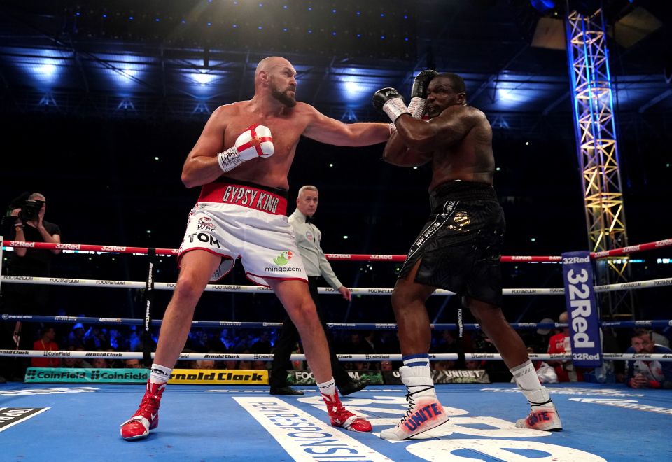 Tyson Fury punches Dillian Whyte during their huge Wembley showdown