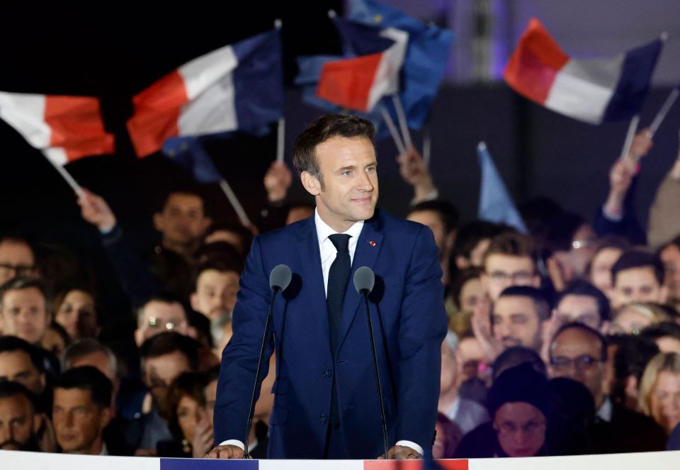 The French President reacts as he delivers a speech following his victory