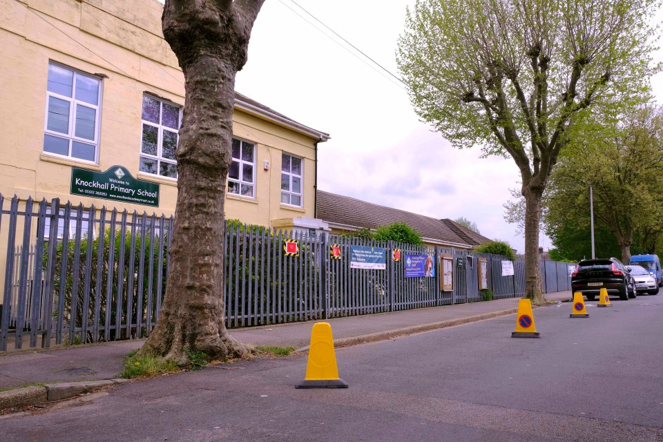 Cones have been used to section off space for a bus outside Knockhall Primary School -but some say it's worsening existing problems at busy times