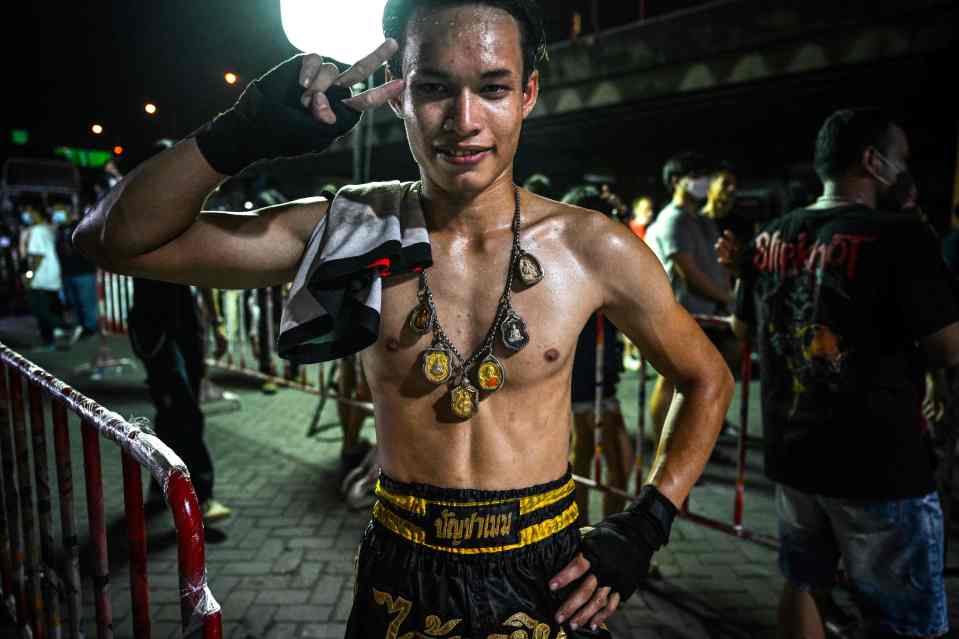 One amateur Muay Thai fighter poses during the unsanctioned contest