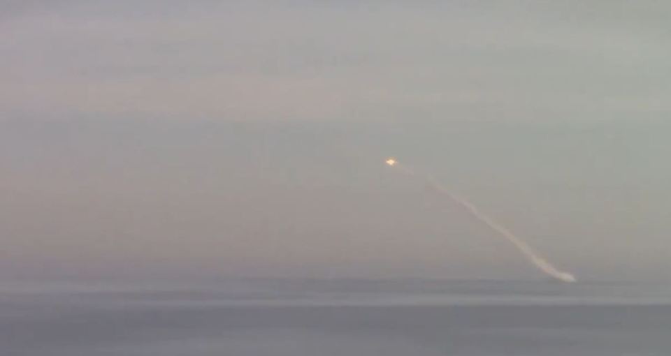 A Kalibr cruise missile streaks into the sky after being launched from under the Black Sea