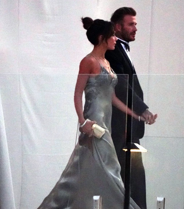 David and Victoria walk hand in hand after the ceremony