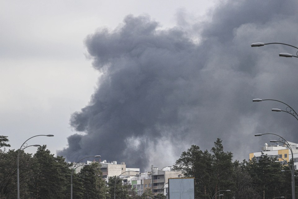 Smoke is seen rising over the Darnyts’kyi district of Kyiv after a Russian airstrike