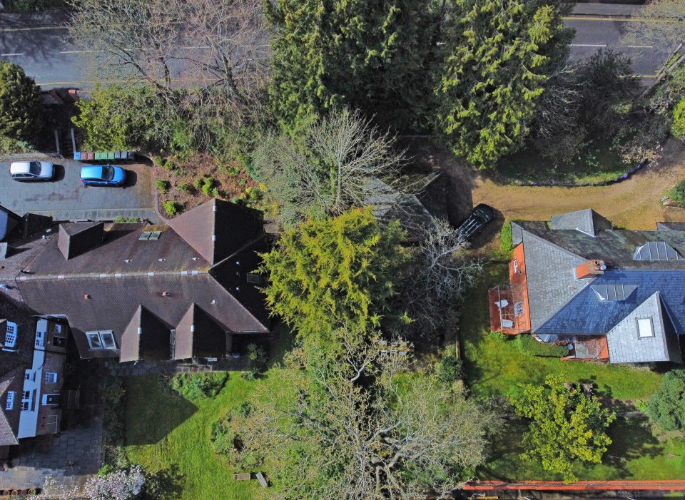 Neighbours of a huge six-bed property in Winchester have spoken of their fury after the owner was given permission to knock down a garage, pictured centre, and build a brand new three-storey block